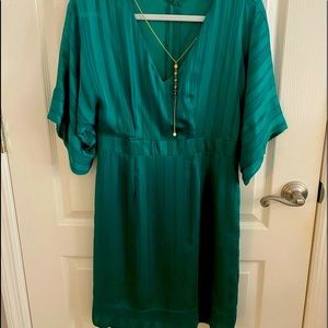 Thalia and Soda Bright Green Dress with Gold Chain.